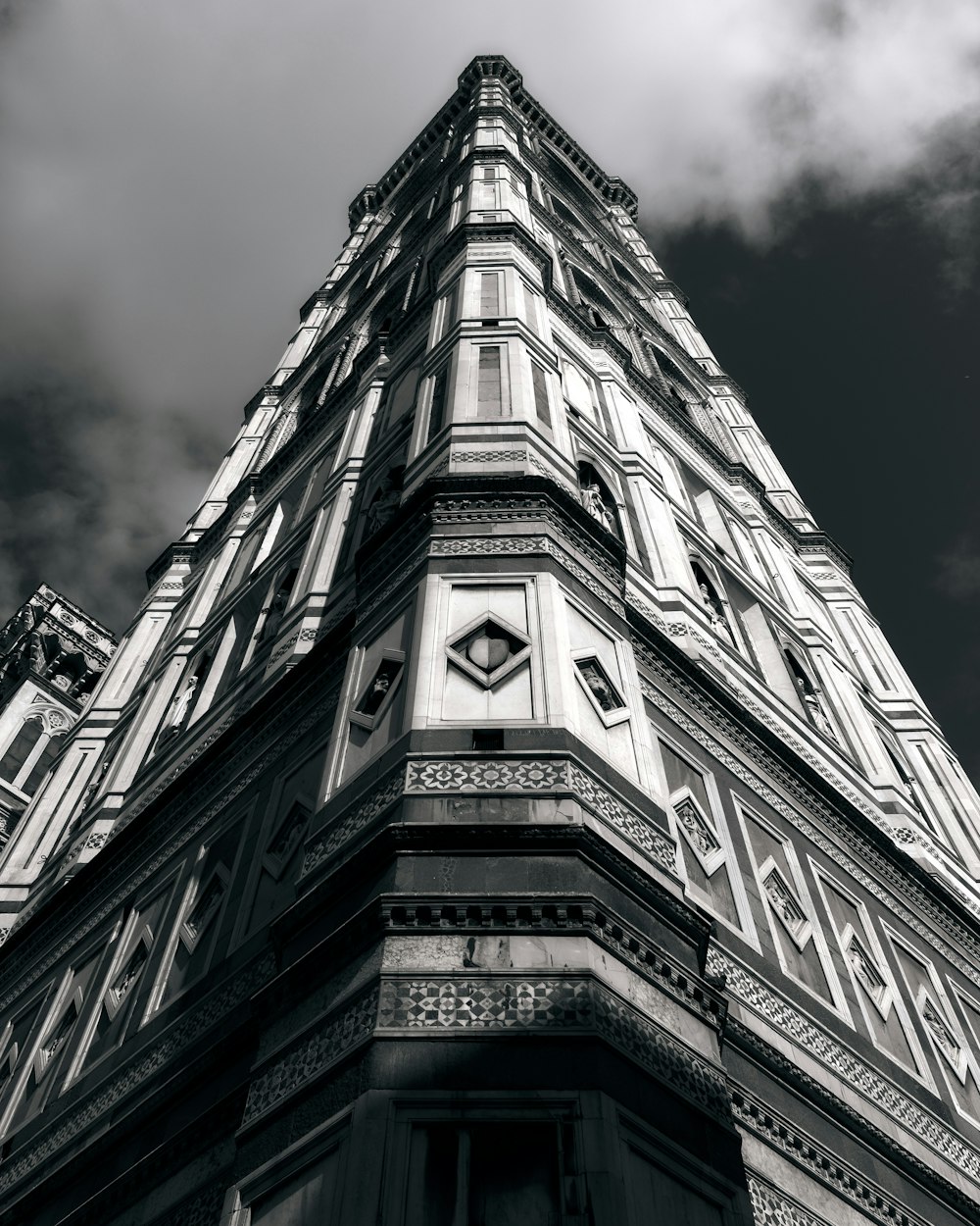 a black and white photo of a clock tower