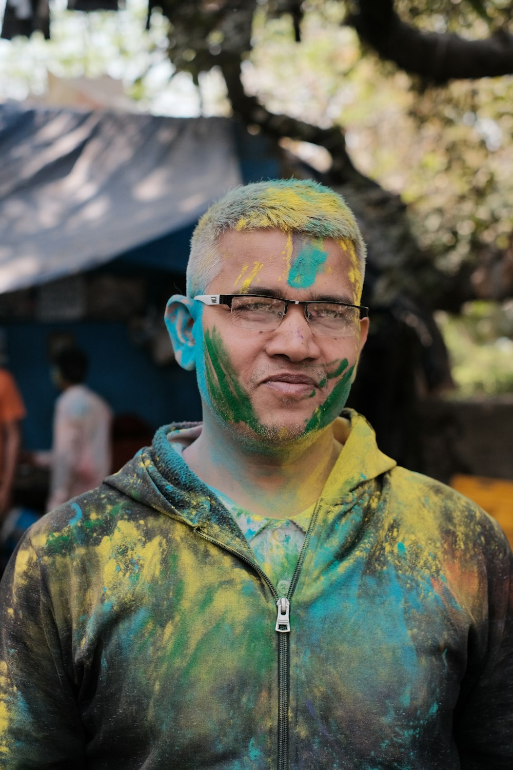 a man with a painted face and glasses