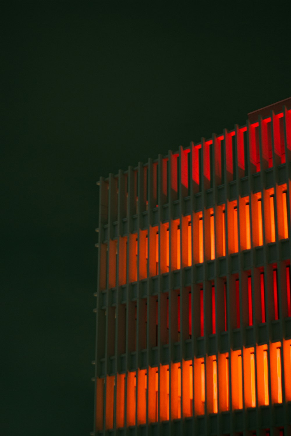 a building that has some orange lights on it