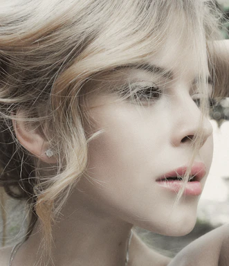 A stylish portrait of Mike Warr capturing a model in a fashion shoot with soft natural lighting.