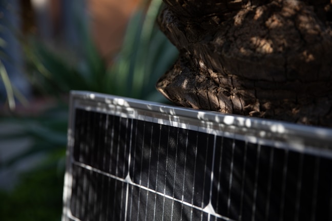 Close-up of a solar battery charger with sunlight.