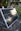 a solar panel sitting on the ground in a garden