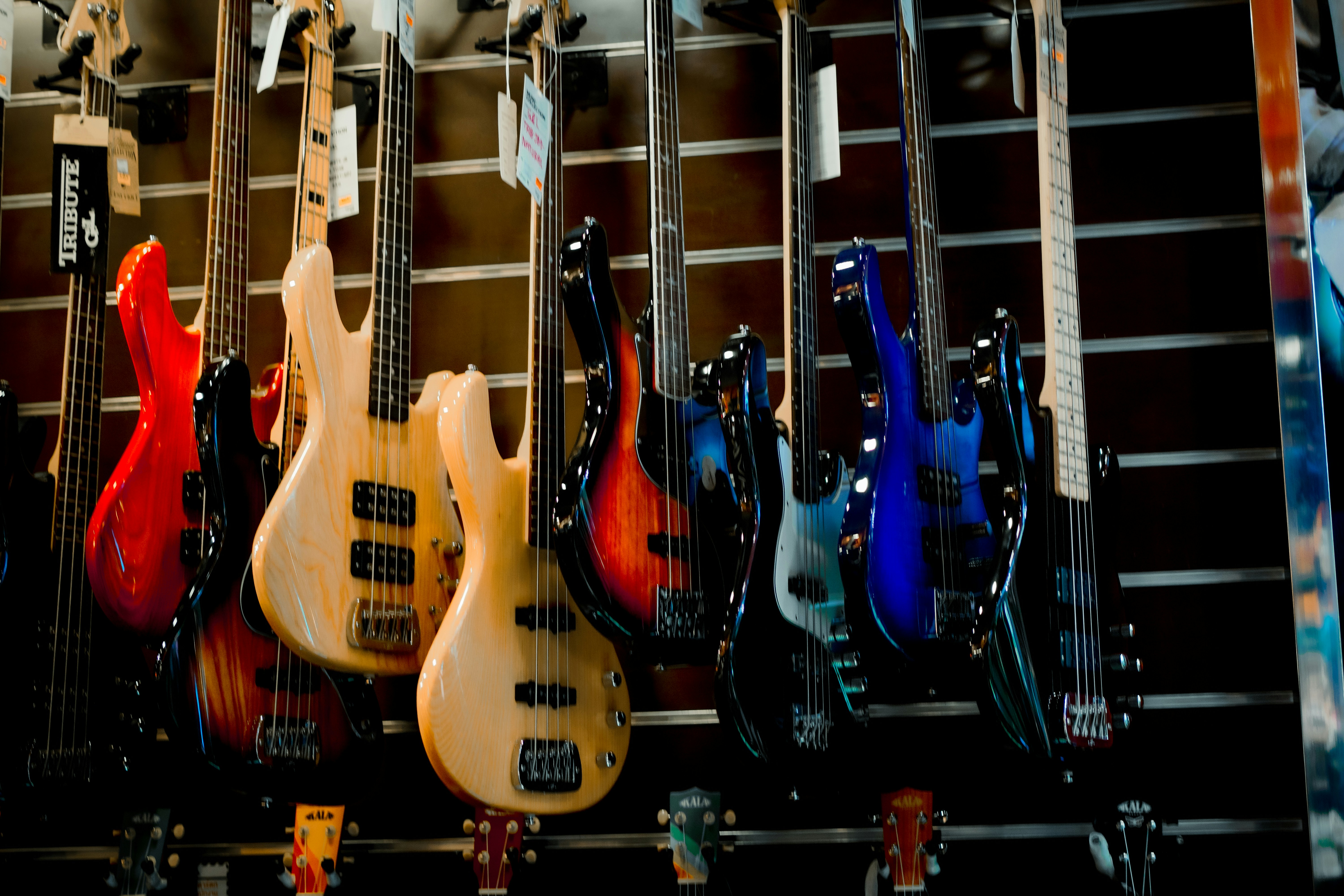 a group of guitars hanging on a wall