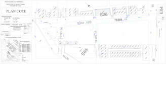 A detailed blueprint overlaying a city map highlighting infrastructure and property boundaries.