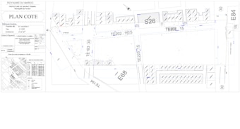 Architectural or urban planning layout with labeled sections and codes. It includes detailed dimensions, various structural elements, streets, and plot numbers. There are also annotations and technical notes.