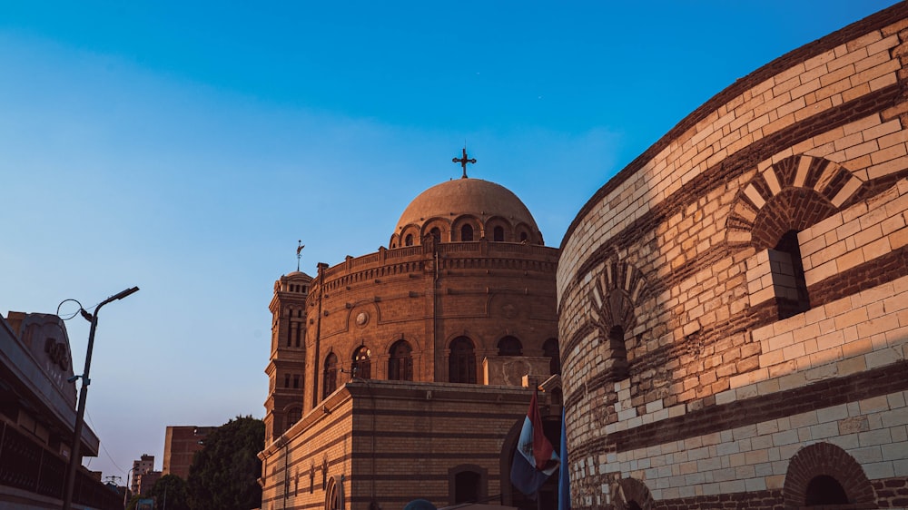 a large building with a cross on top of it