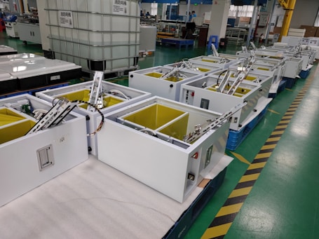 Photo of MSC team installing industrial coding equipment in a factory setting.