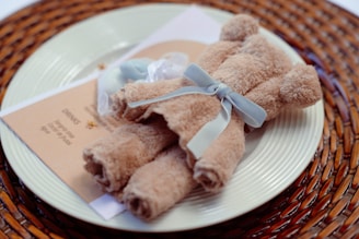 Soft cotton baby towels folded neatly with a cookie shape design