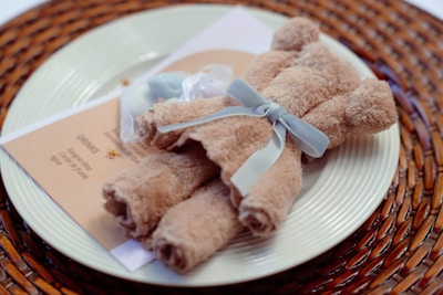 Soft cotton baby towels folded neatly with a cookie shape design