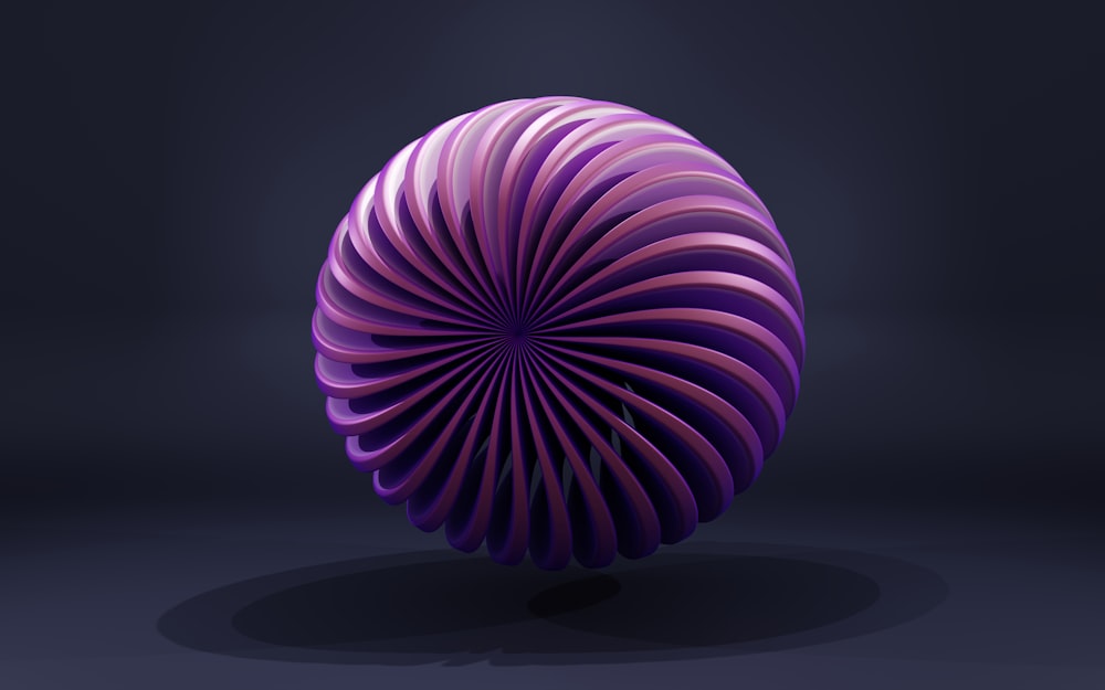 a purple object is shown in a dark room