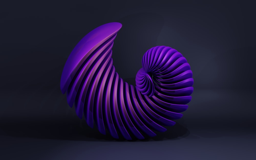 a purple sculpture is shown against a dark background