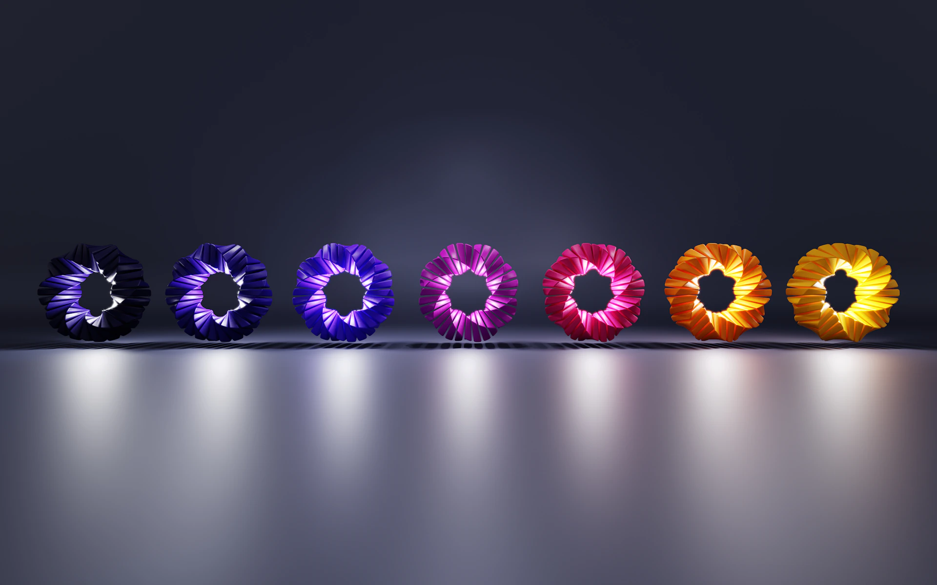 a row of colorful flowers sitting on top of a table