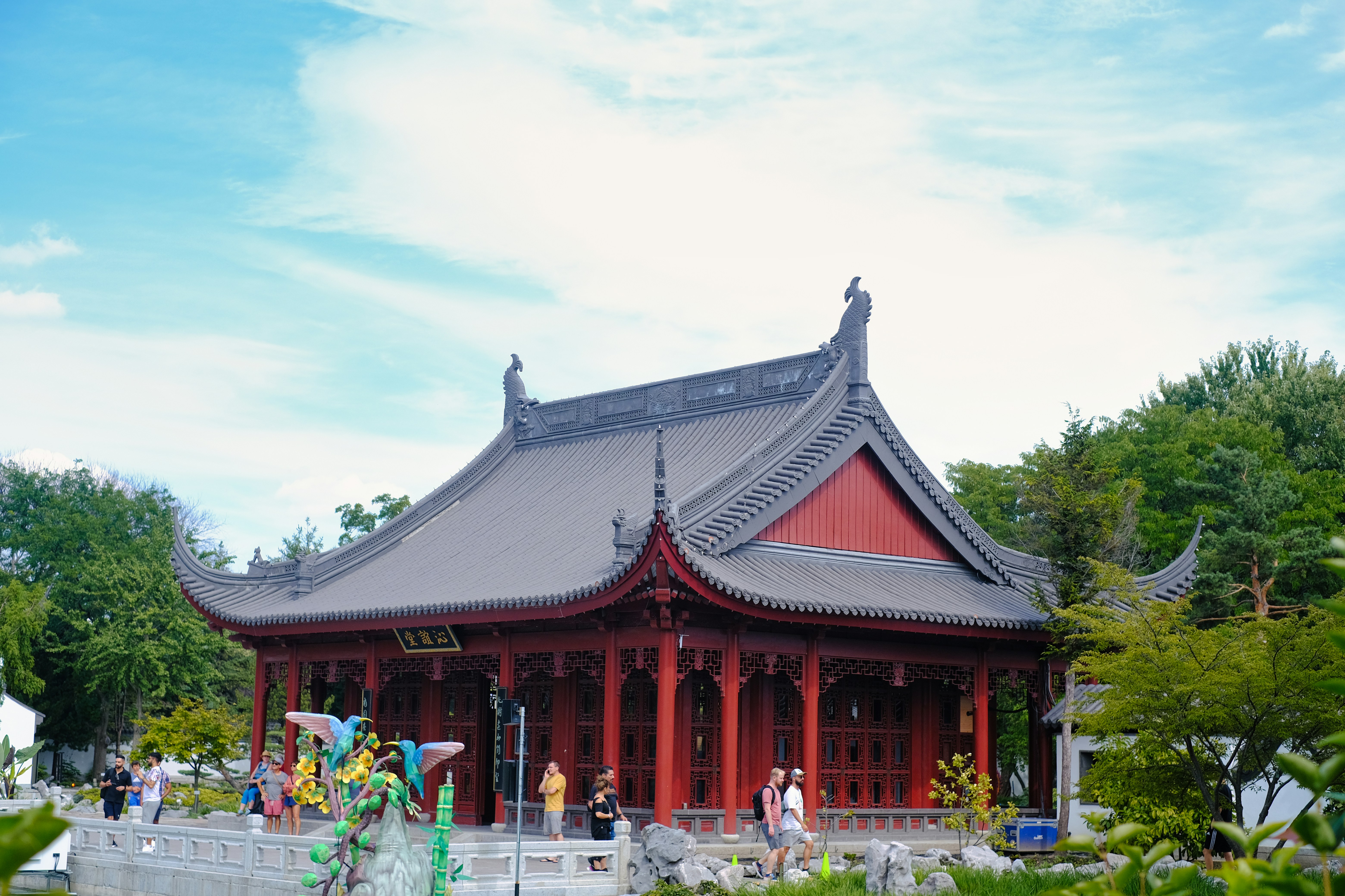 a building with a lot of people walking around it