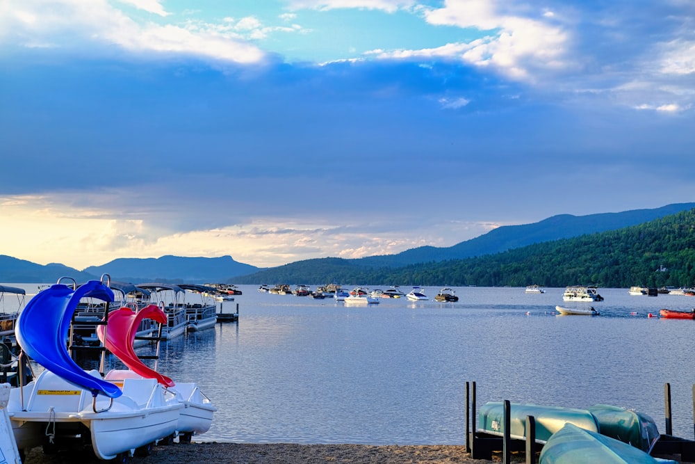 a group of boats that are sitting in the water