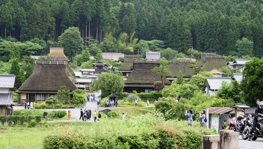 A peaceful Southeast Asian village with a local health center nestled among greenery.