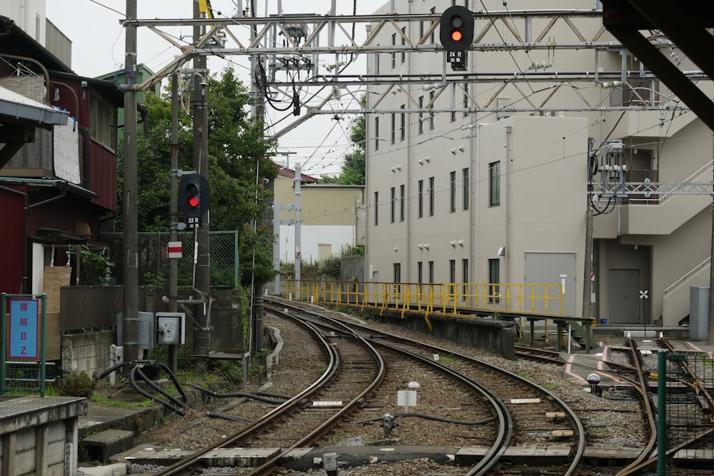 a train track with a red light at the end of it