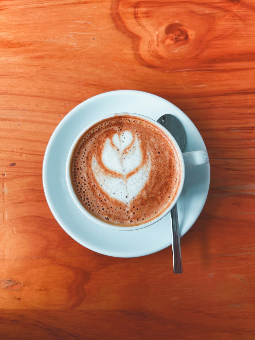 a cup of coffee with a heart drawn on it