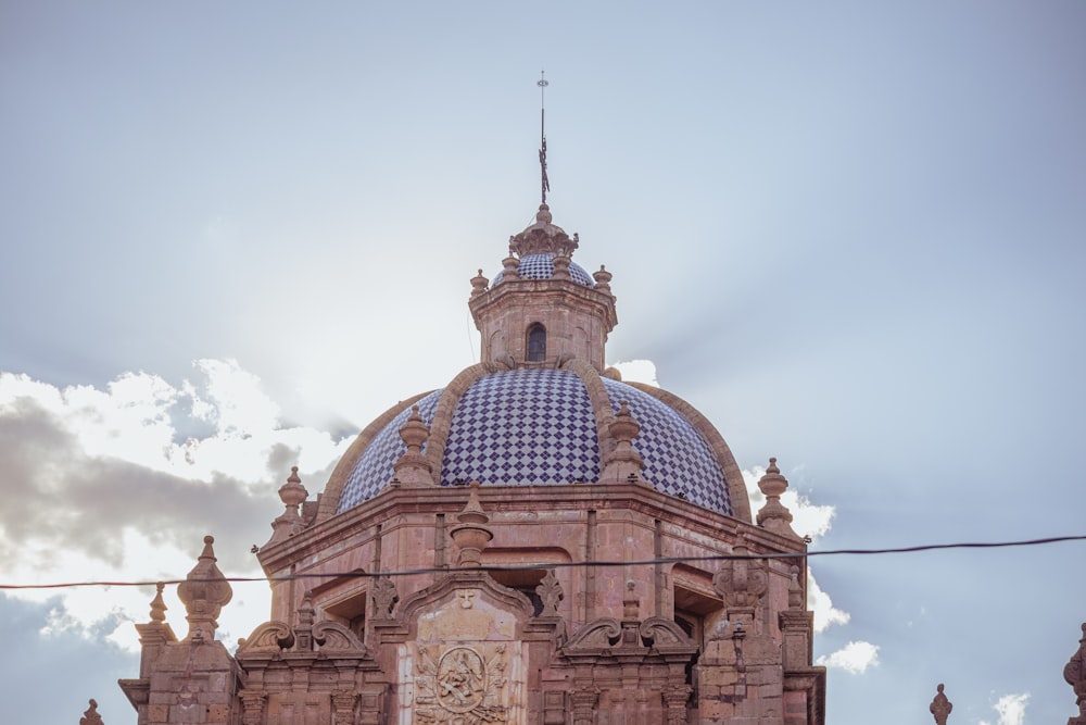 a building with a blue and white checkered dome