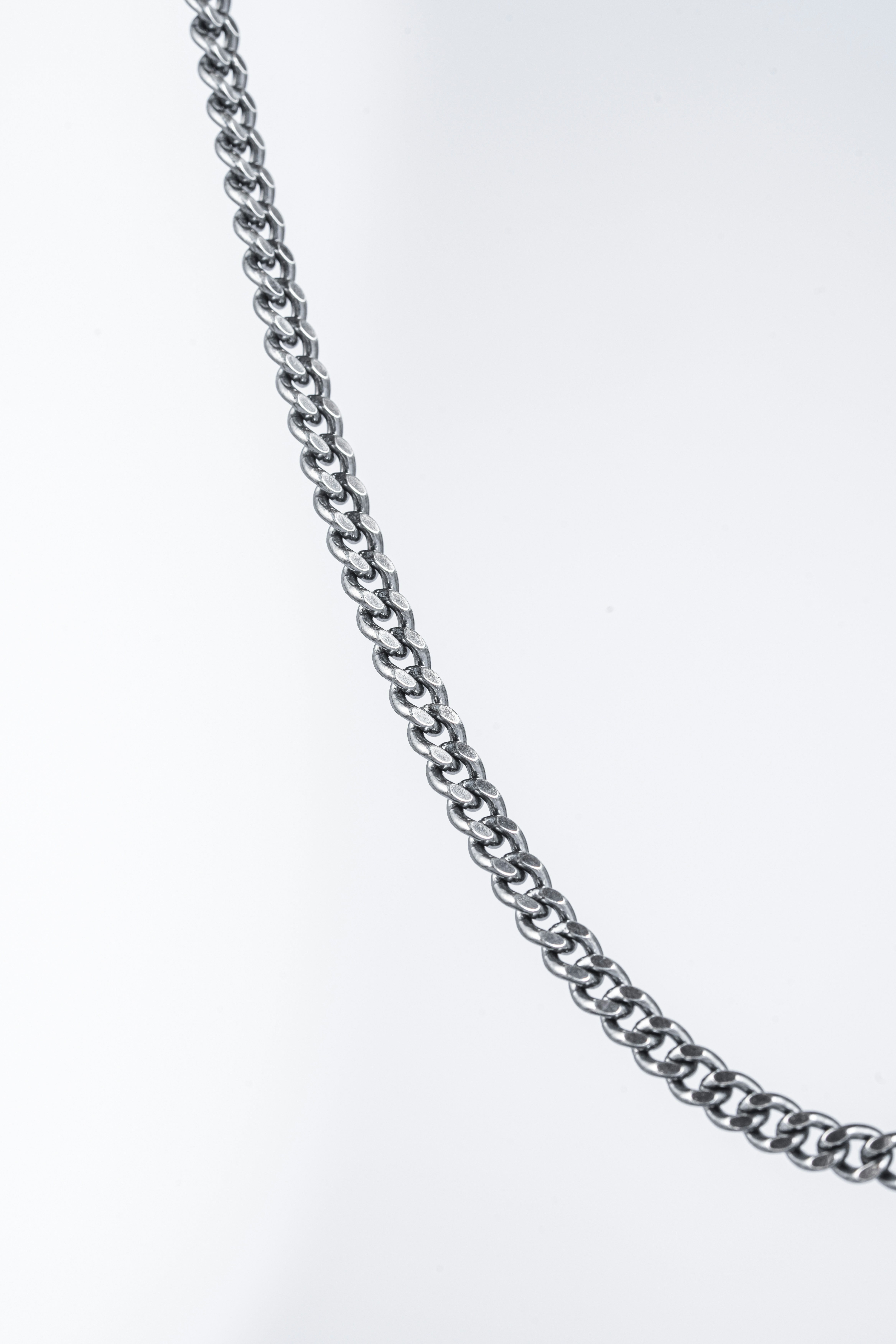 a close up of a chain on a white background
