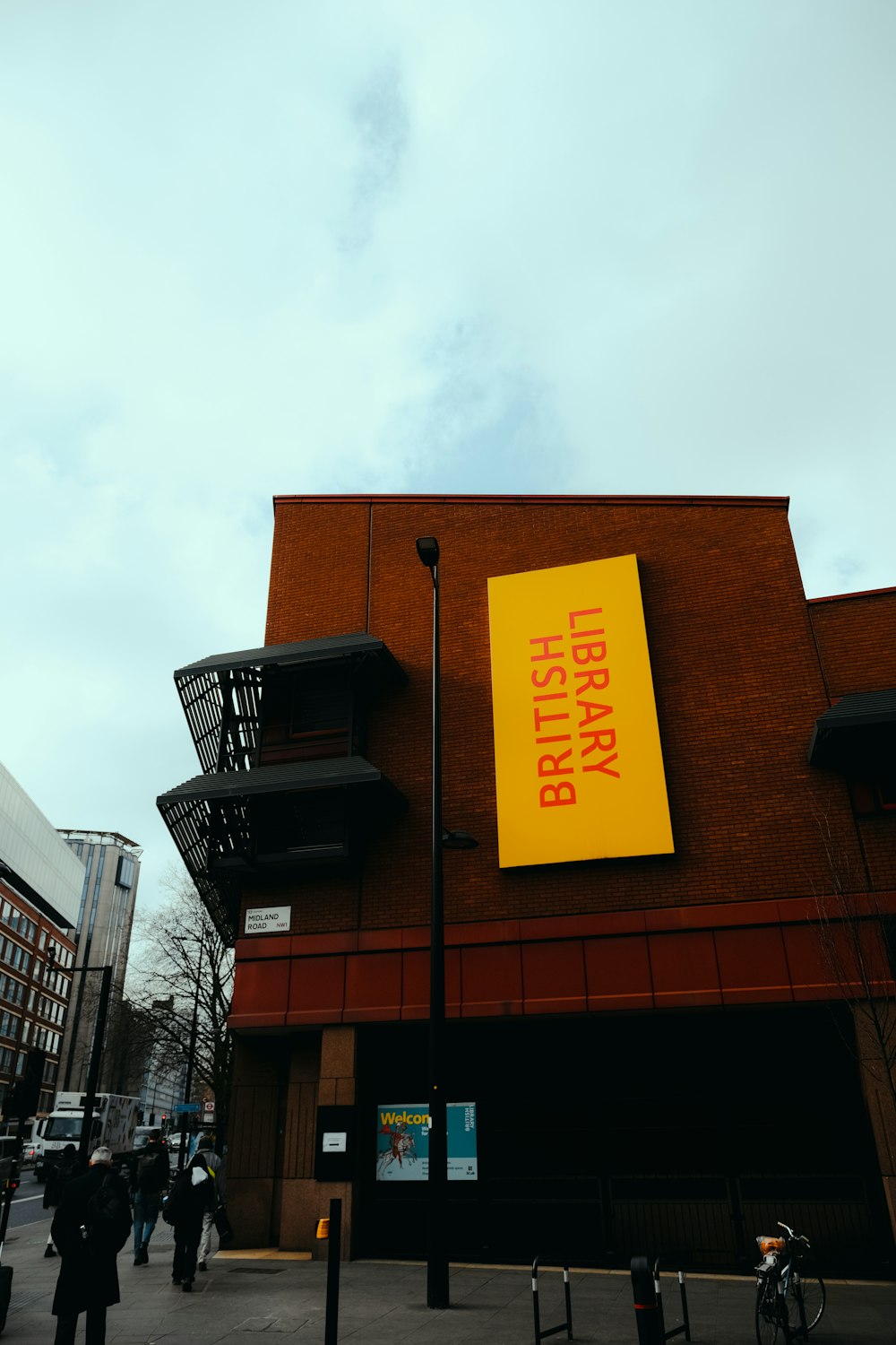 a building with a large yellow sign on the side of it