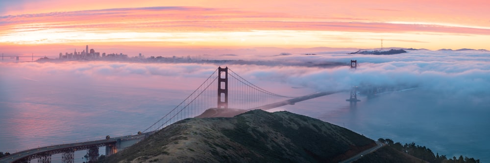 a view of the golden gate bridge from above the clouds