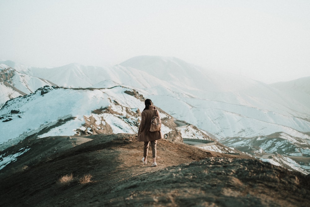 a person standing on top of a mountain