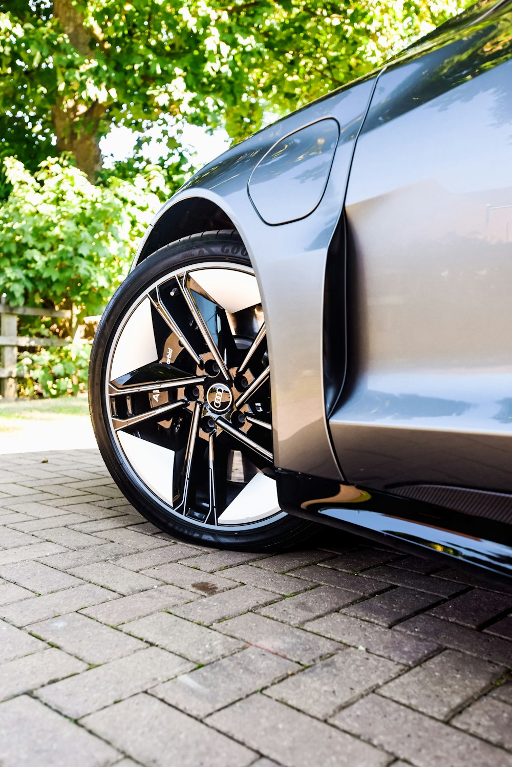 a close up of a car parked on a brick road