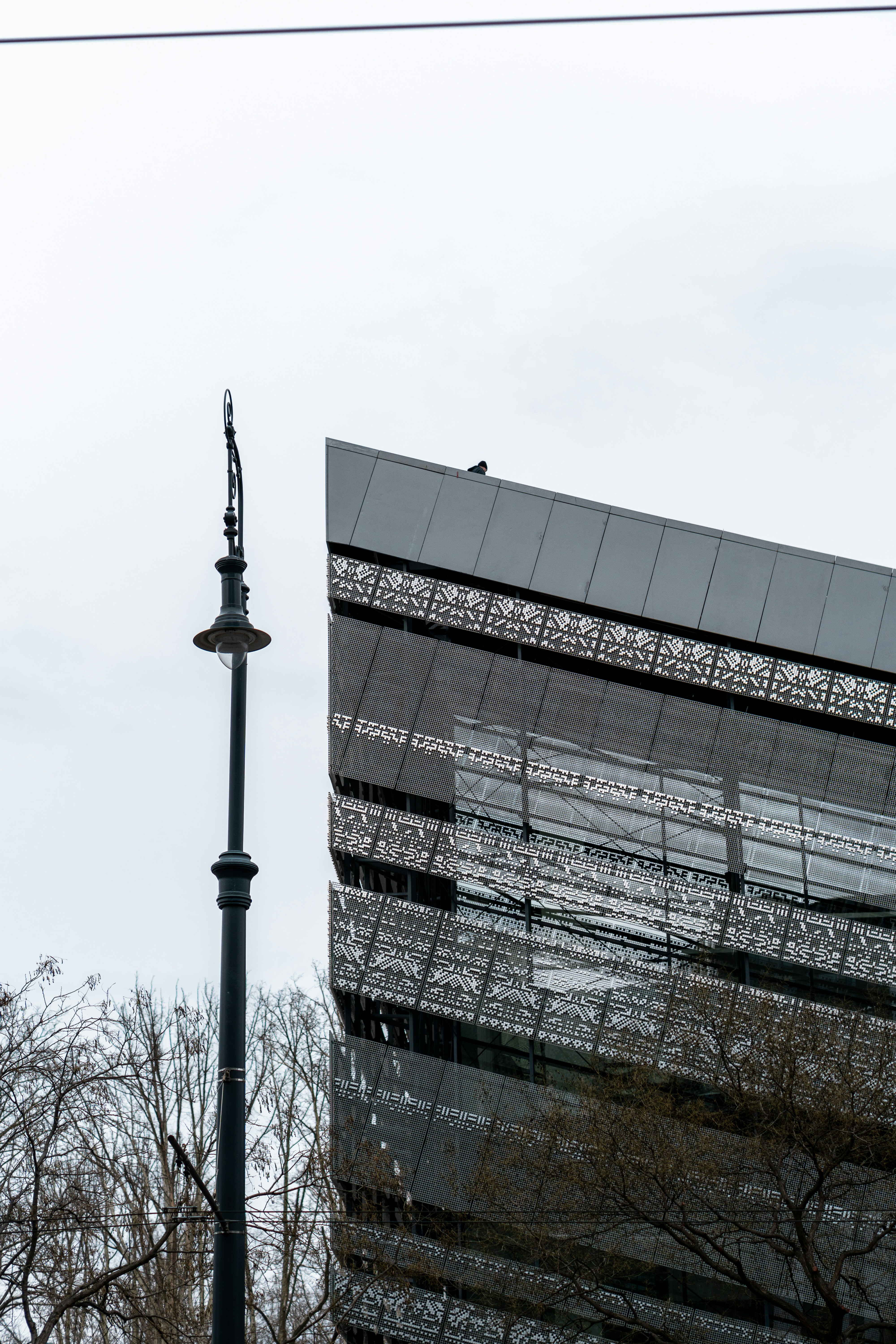a tall building next to a street light