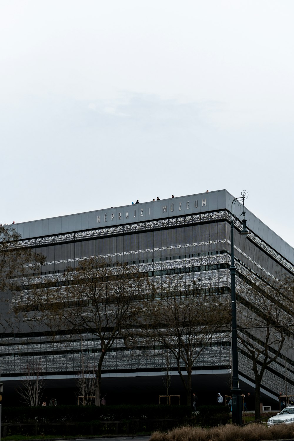 a large building with trees in front of it