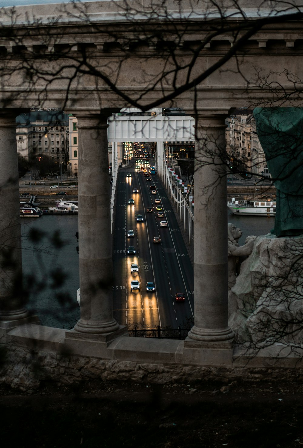 a view of a city from a bridge at night