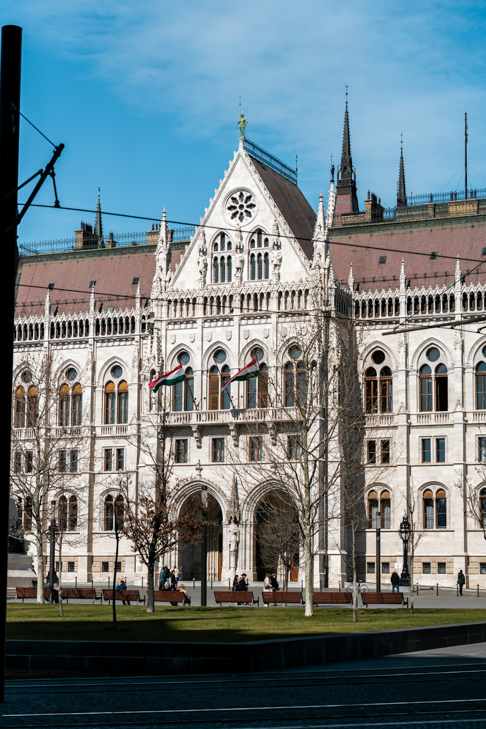 a large white building with a clock on the front of it