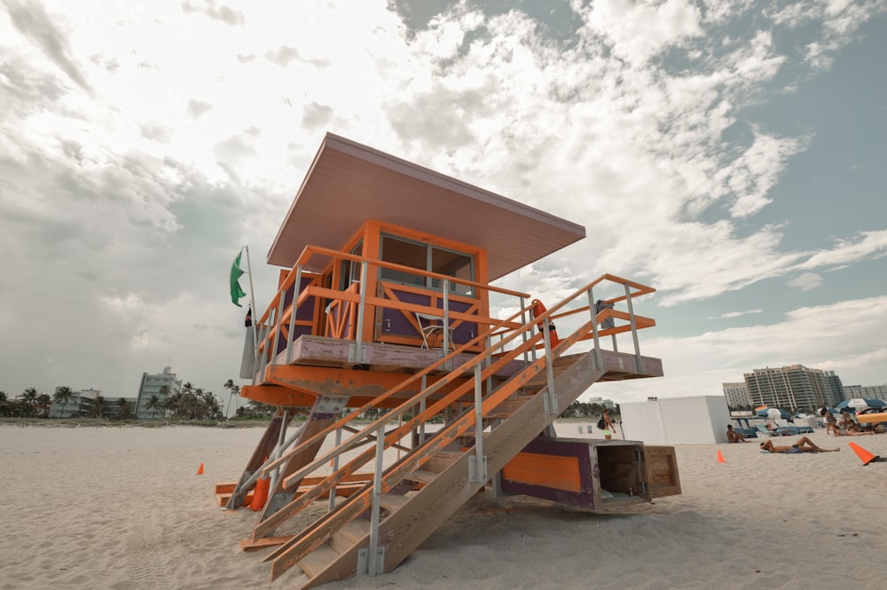 a lifeguard station on a beach with a sky background