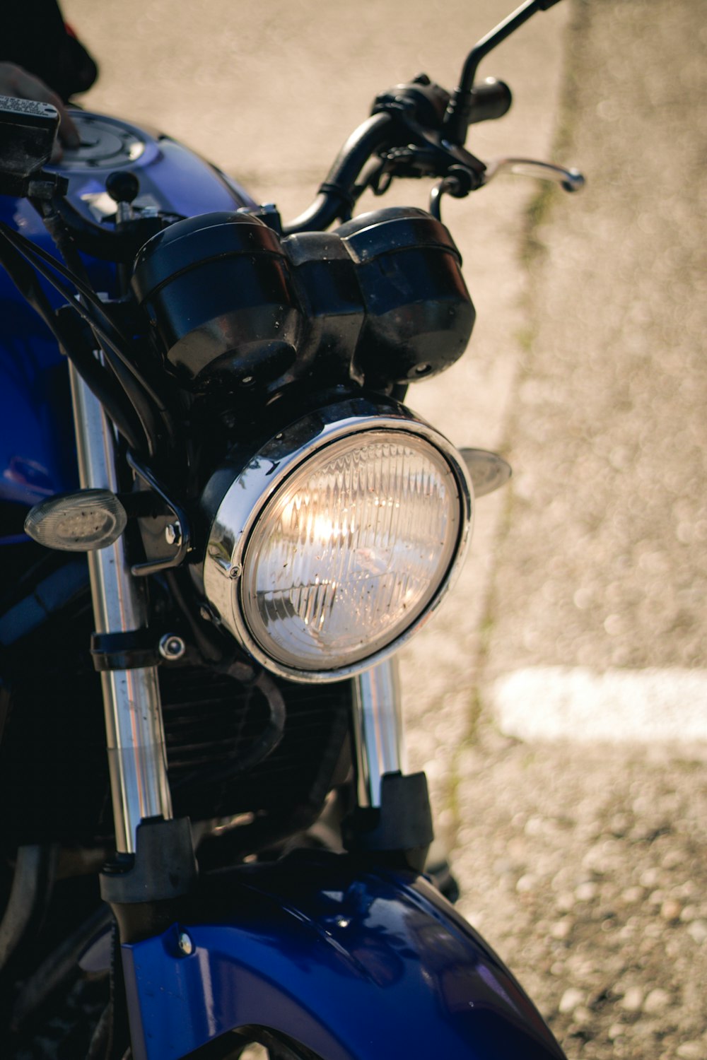 a close up of a motorcycle's headlight