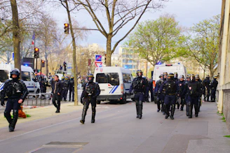a group of police officers walking down a street