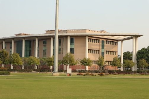 a large building with a flag pole in front of it