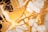 Intricate patterns of gold and white marble with rich veins, creating an abstract and luxurious visual texture.