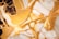Intricate patterns of gold and white marble with rich veins, creating an abstract and luxurious visual texture.