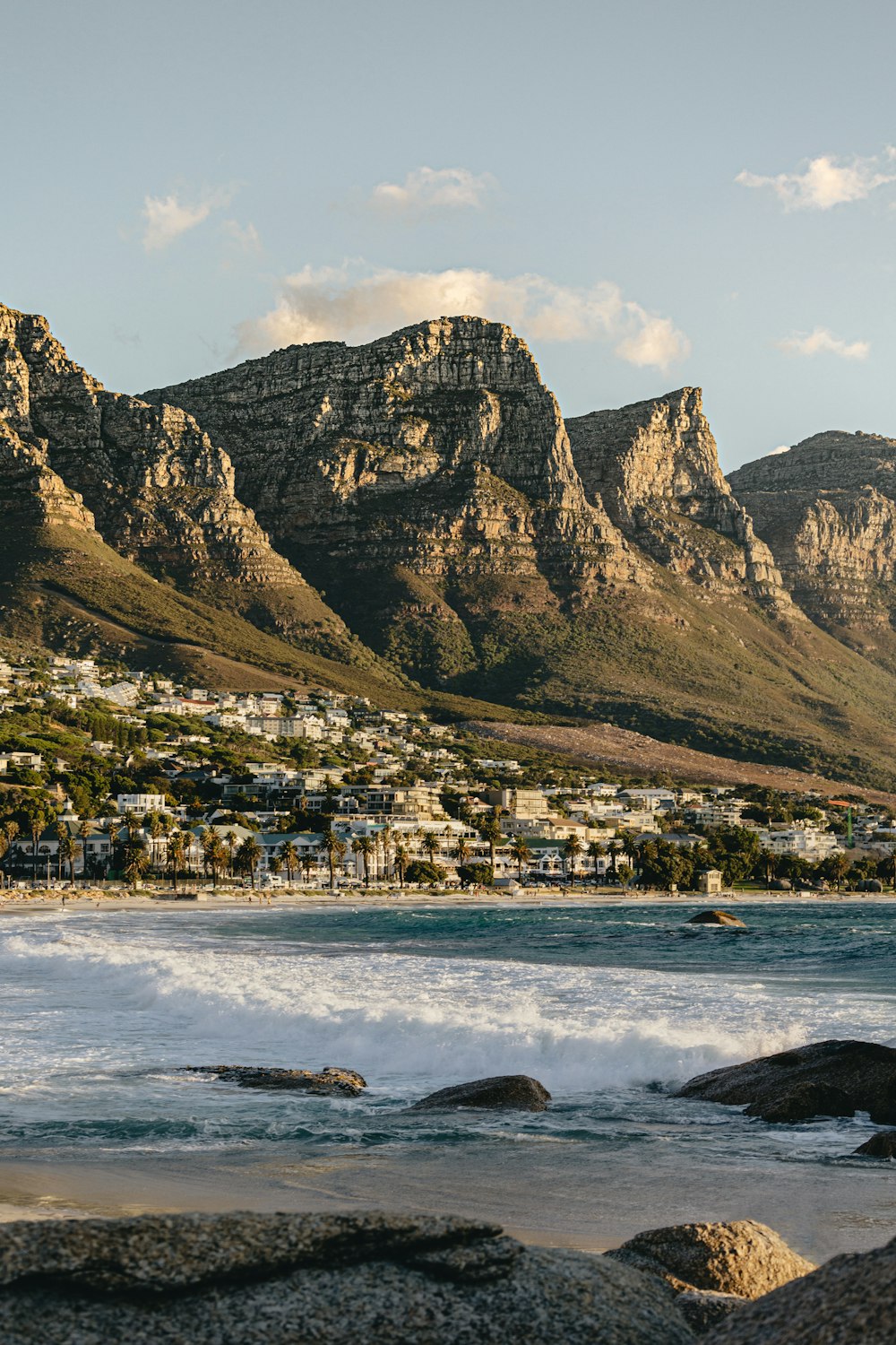 a view of a beach with mountains in the background