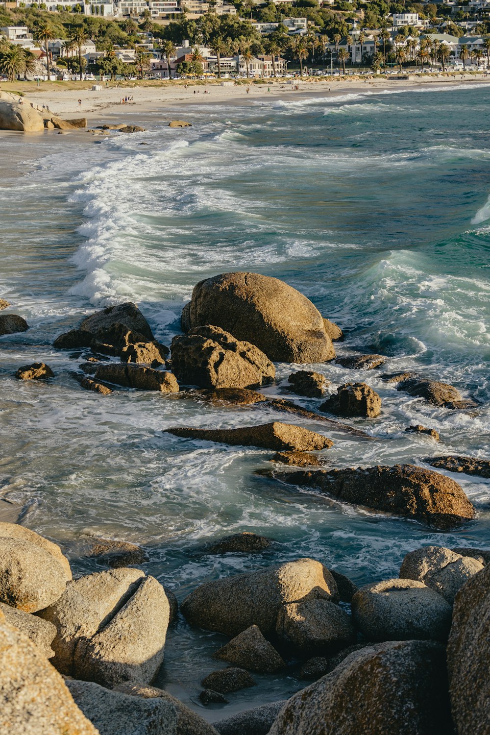 a view of the ocean from a rocky shore