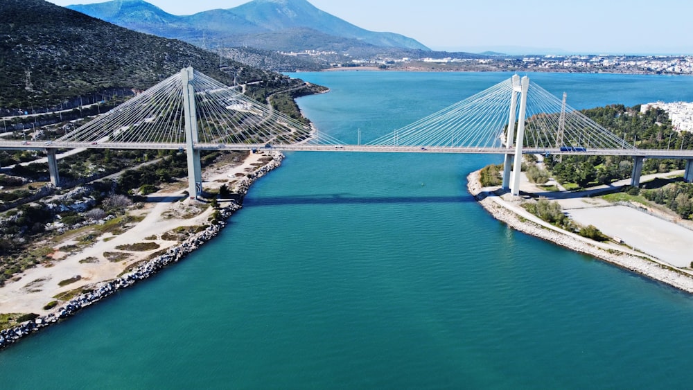 an aerial view of a bridge over a body of water