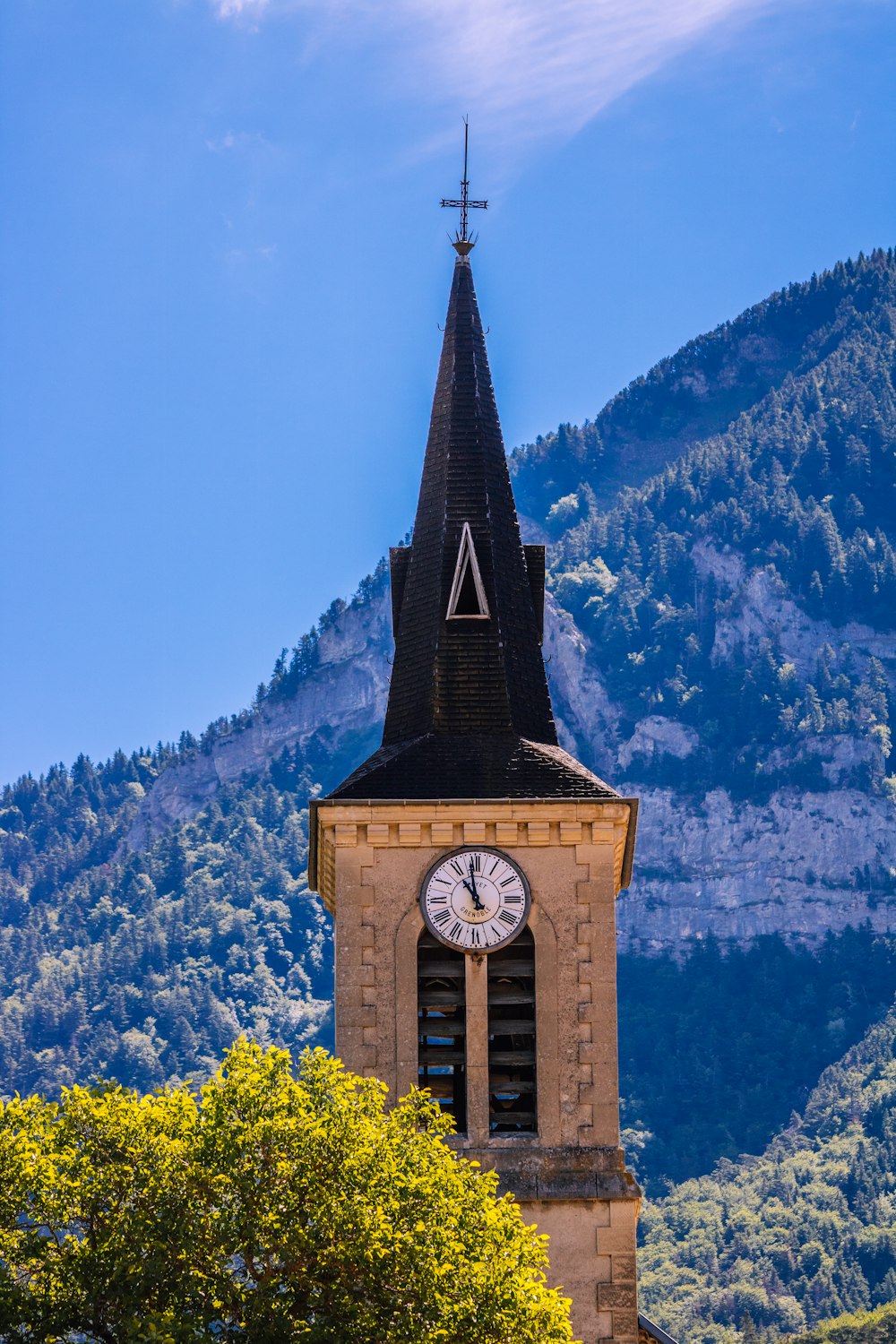 a church steeple with a clock on it