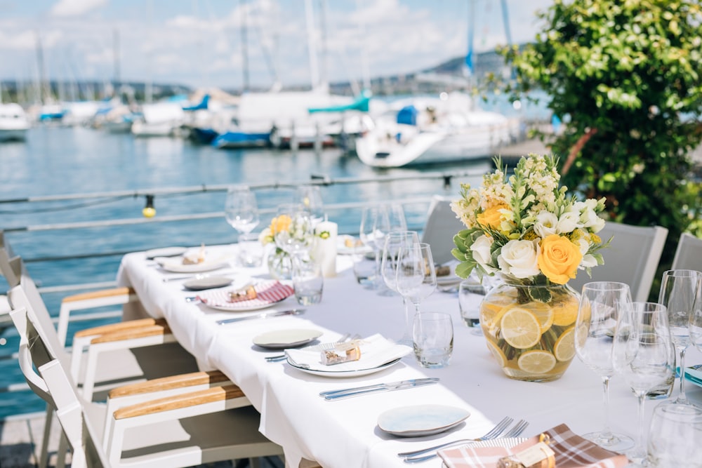 a long table with plates and glasses on it