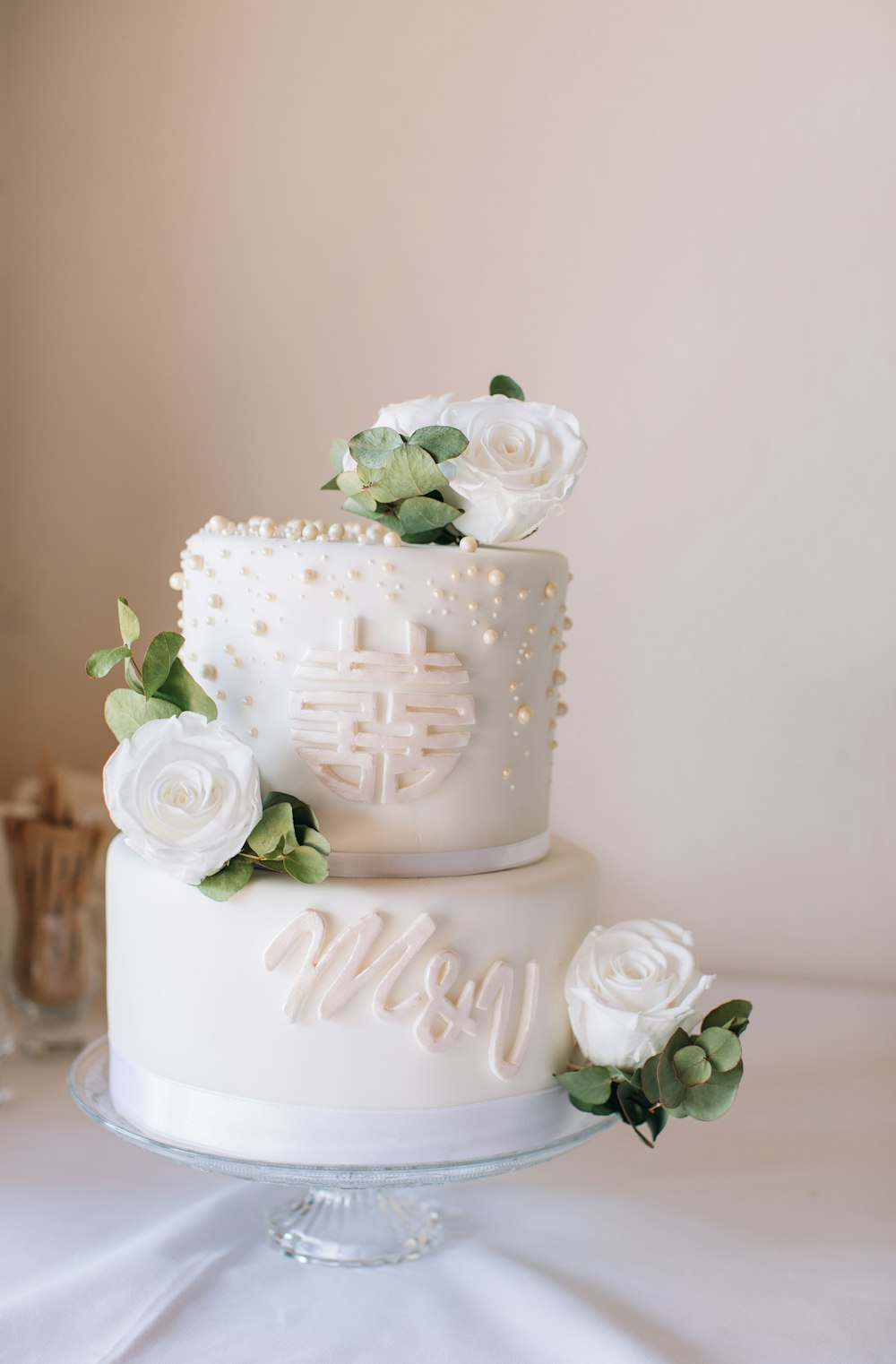 a white wedding cake with flowers on top