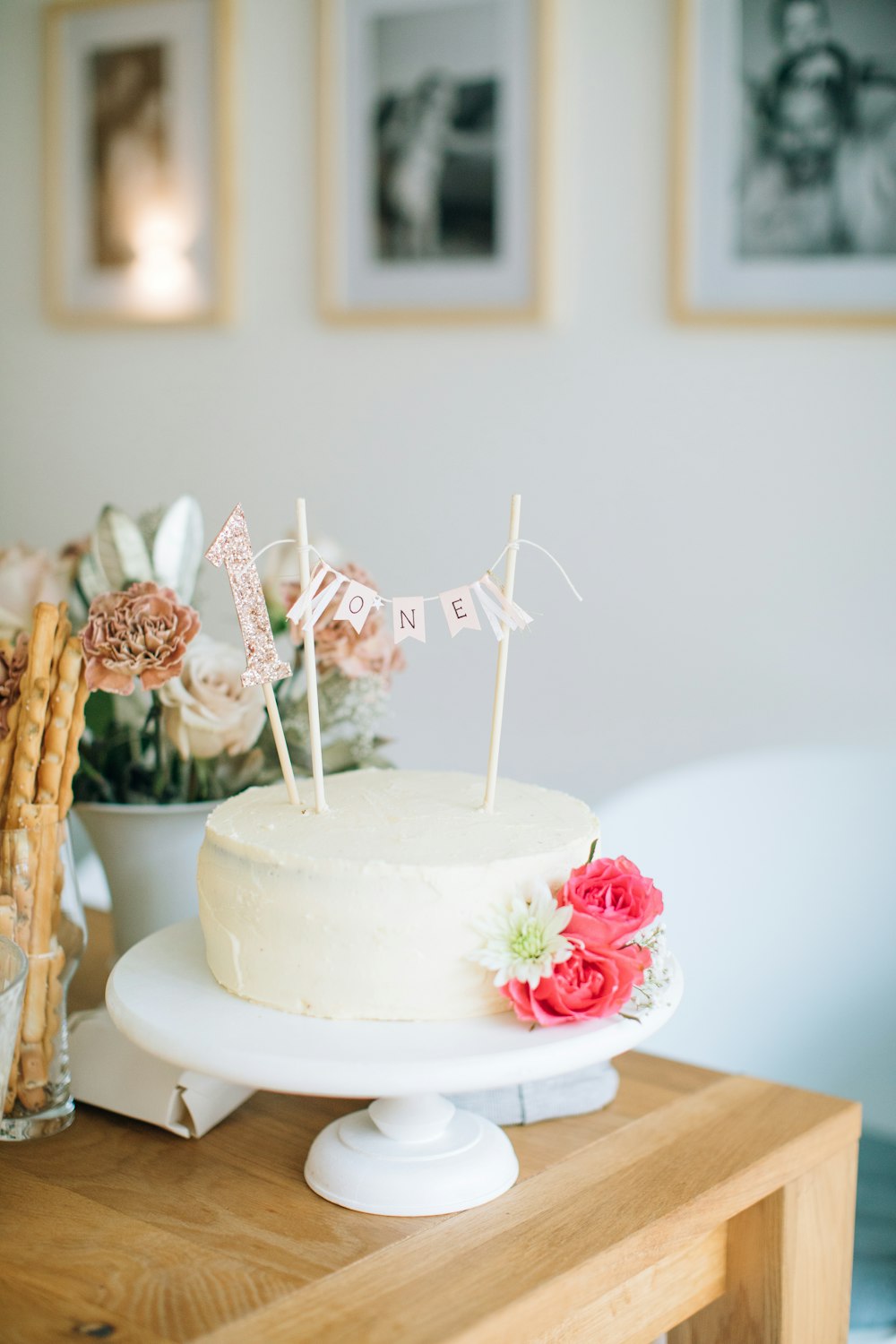 a white cake sitting on top of a wooden table