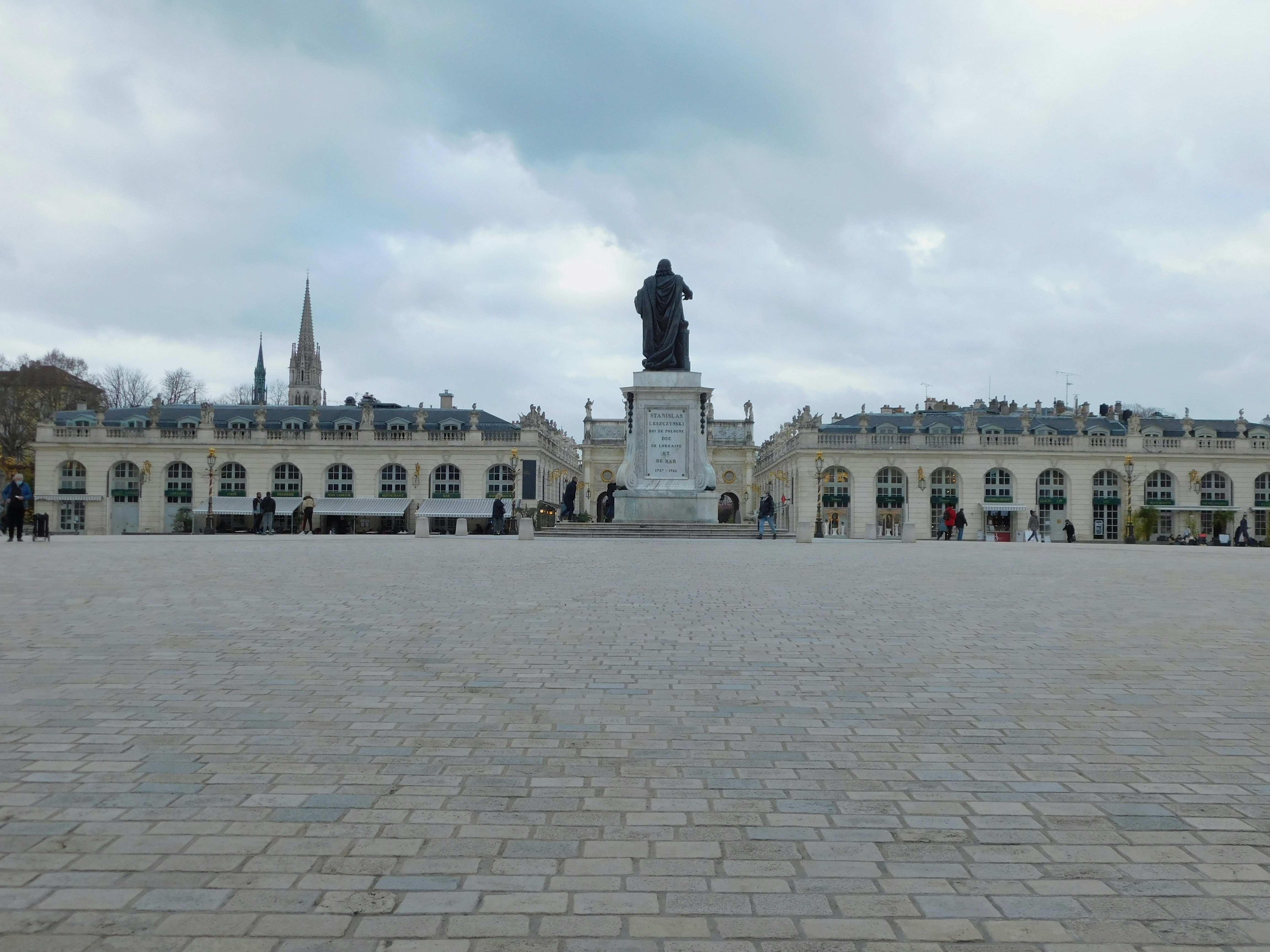 a large building with a statue in front of it