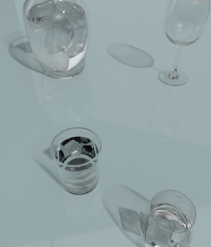 a glass of water and a glass of wine on a table