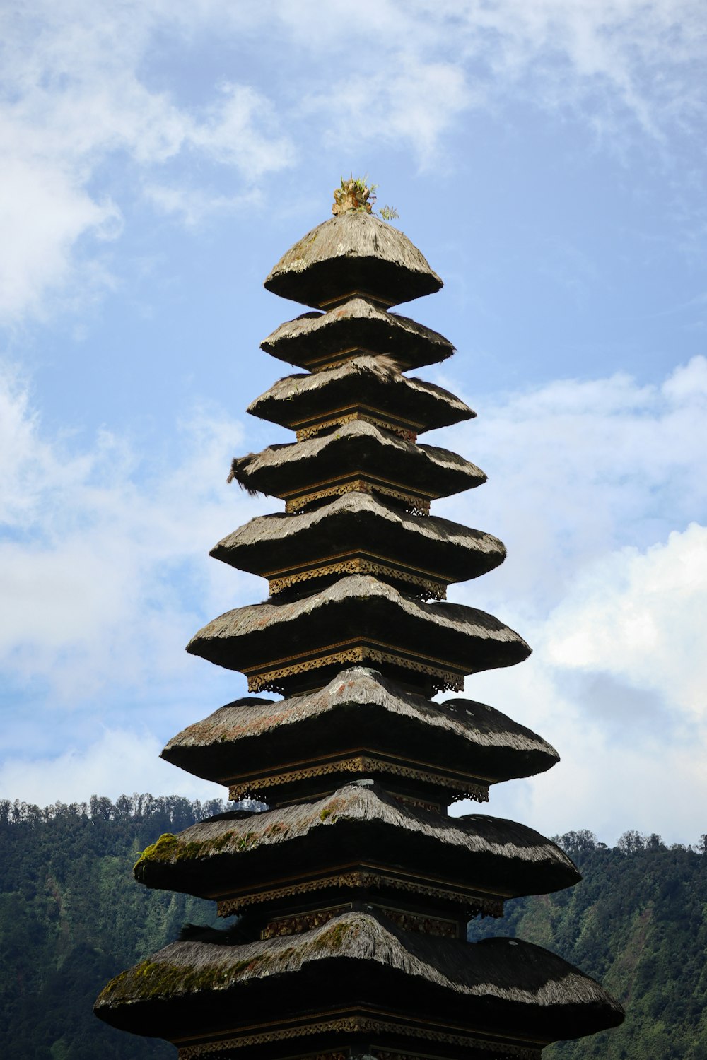 a tall tower made of rocks with a sky background