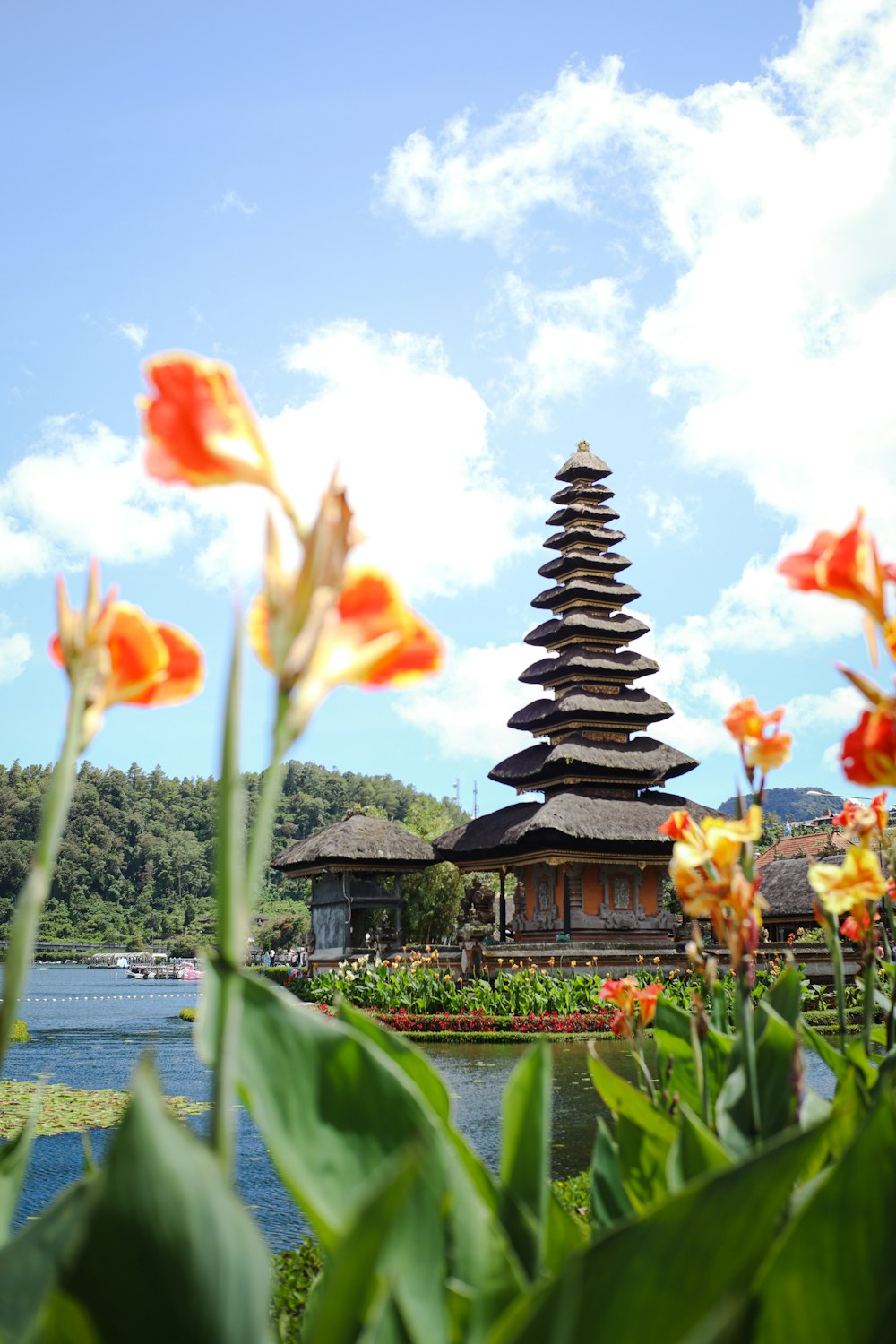 a pagoda in the middle of a field of flowers