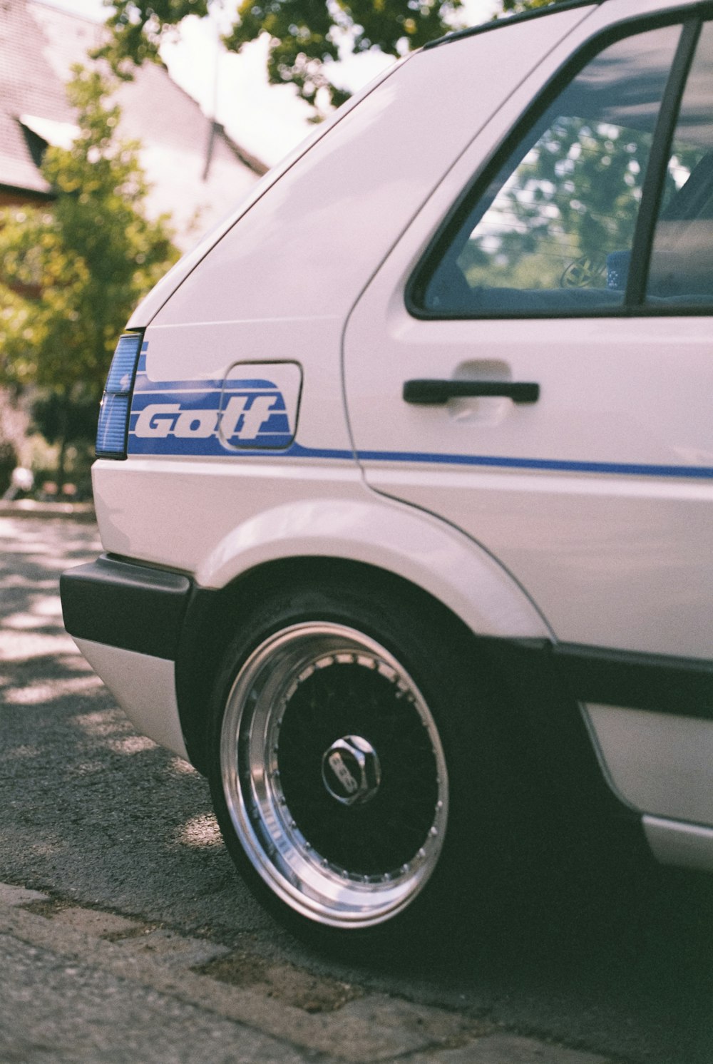 a white car parked on the side of the road