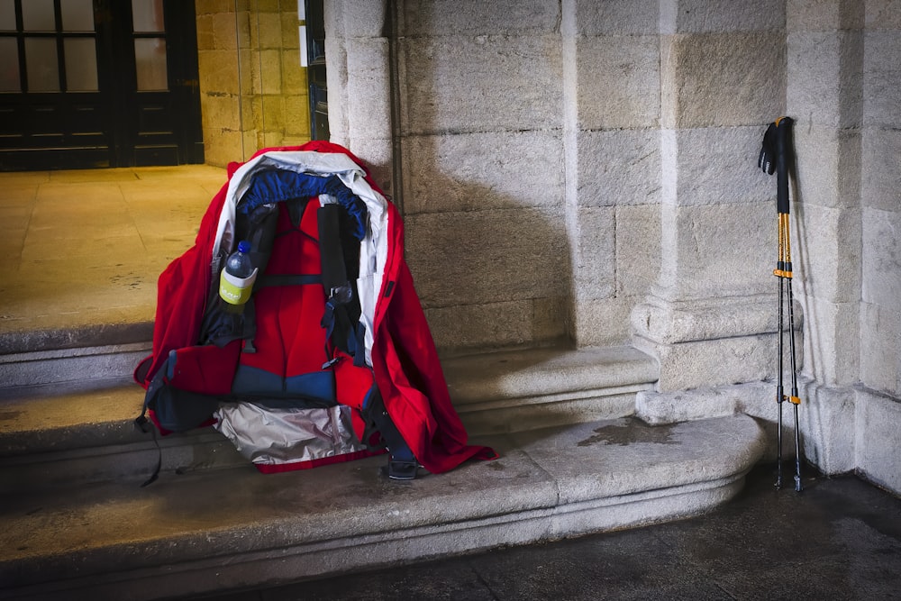 a backpack sitting on the steps of a building